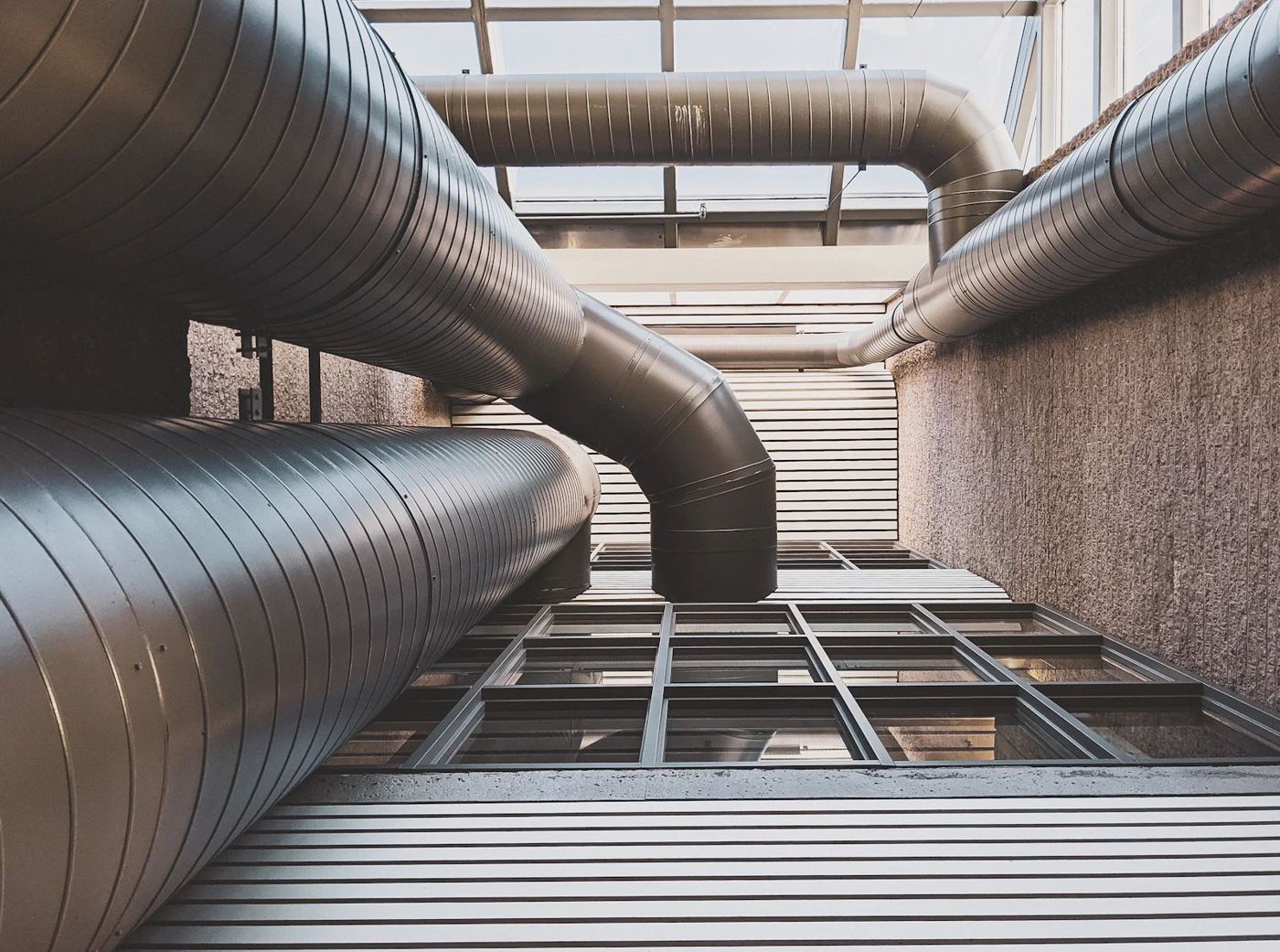 Industrial ductwork running across a ceiling